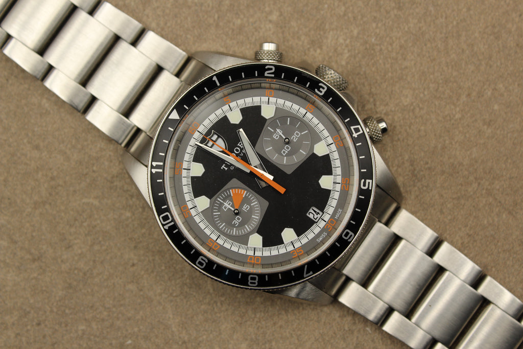 Montre Tudor Heritage Chrono pour homme en acier, modèle emblématique vendu par prestigeandtime.com, présentée en occasion authentique avec full set, idéale pour collection ou investissement horloger.