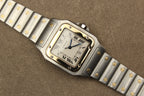 Montre Cartier Santos Galbée pour homme en acier et or, vendue par prestigeandtime.com, présentée en occasion authentique en excellent état avec full set, modèle emblématique idéal pour collection ou investissement horloger.
