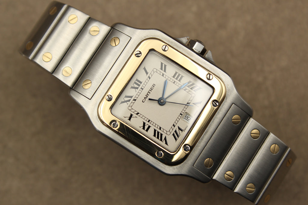 Montre Cartier Santos Galbée pour homme en acier et or, vendue par prestigeandtime.com, présentée en occasion authentique en excellent état avec full set, modèle emblématique idéal pour collection ou investissement horloger.